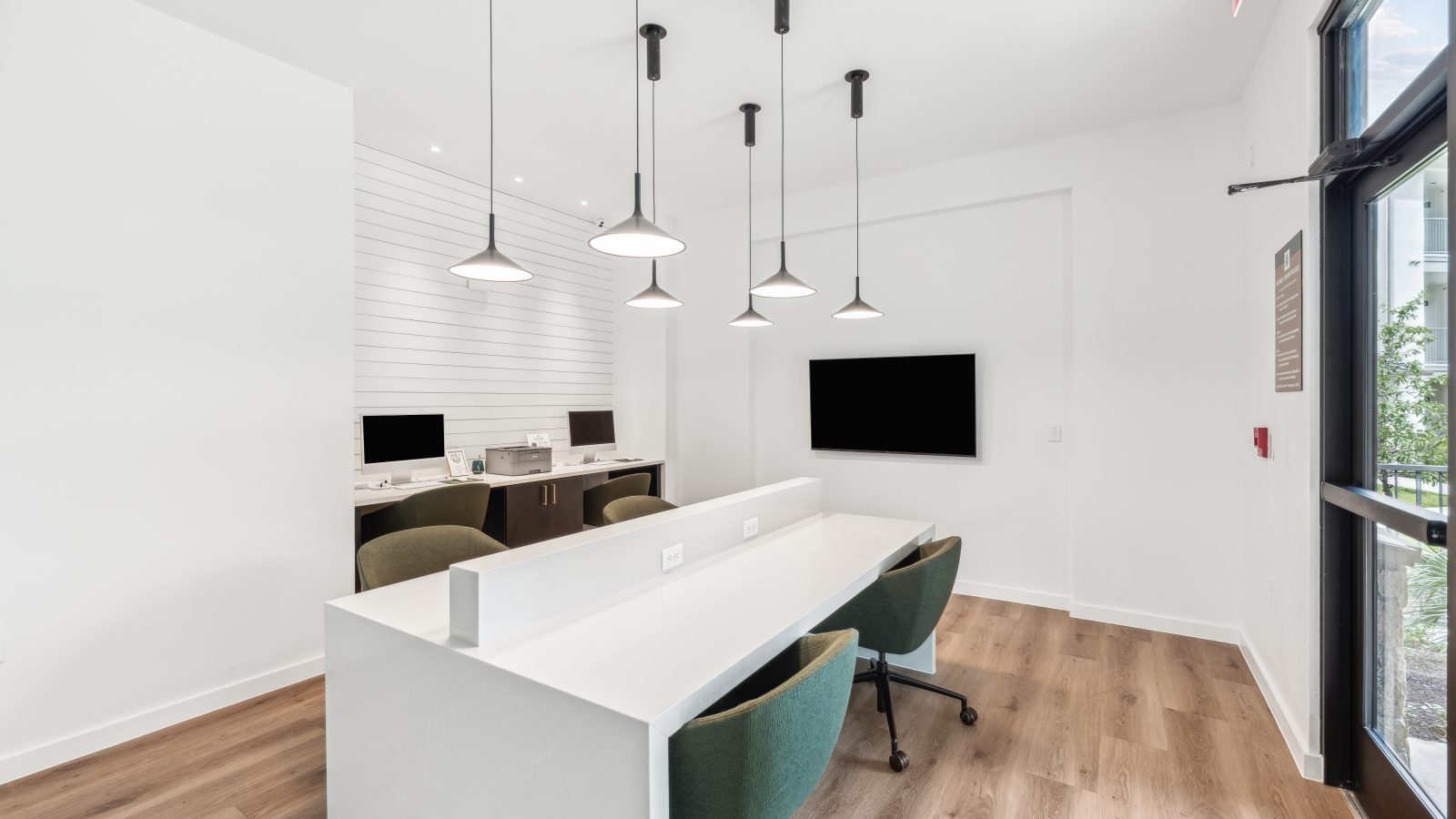 a white office with a desk and chairs at The Rushcreek